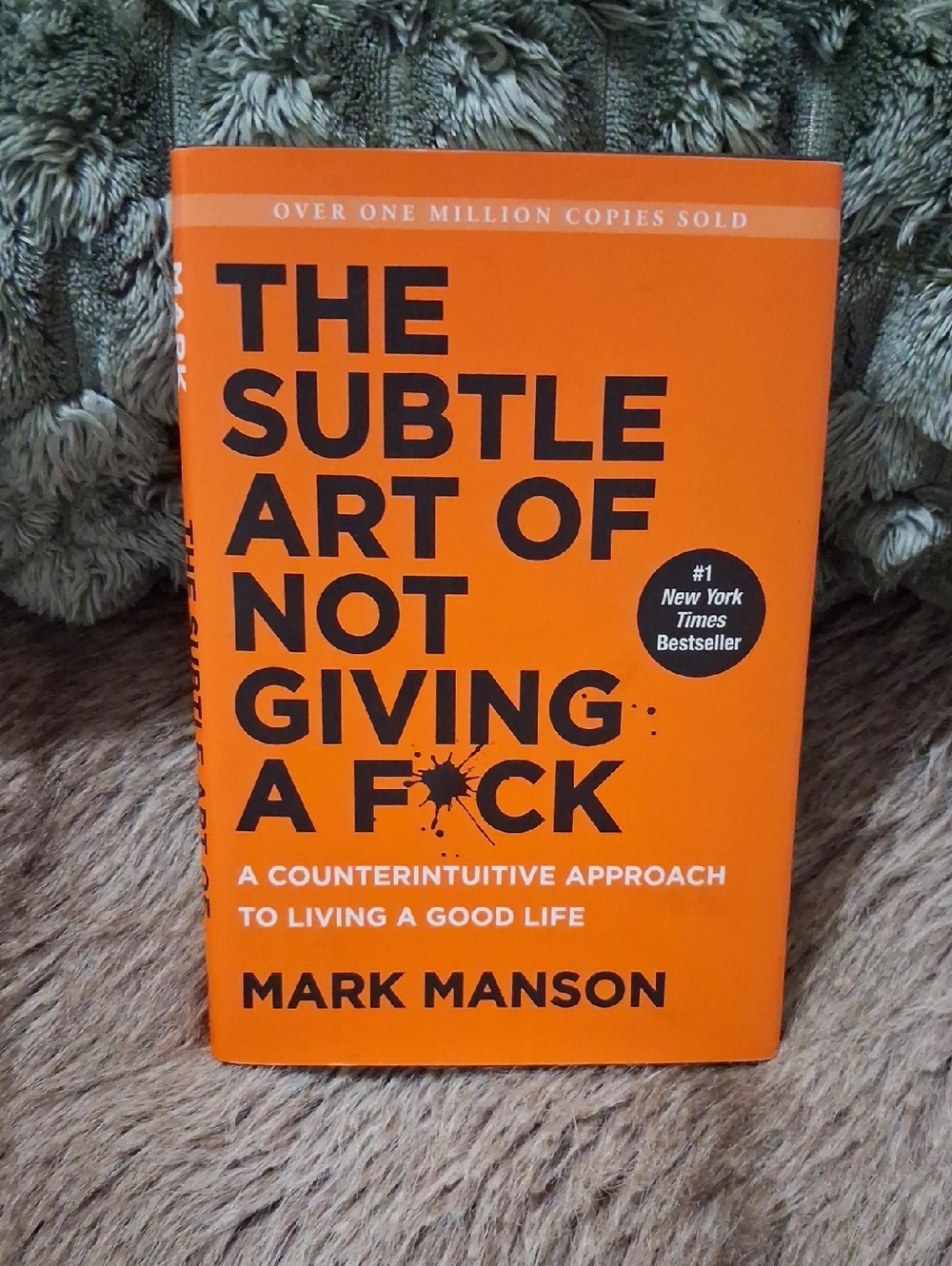 The Subtle Art of Not Giving a F*ck by Mark Manson - Bright Orange Hardcover